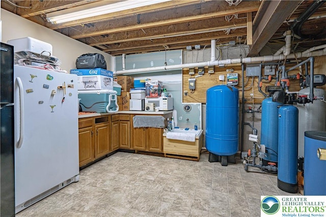 2650 Eagle Ln, Lower Saucon Twp, PA 18055 - unfinished basement featuring freestanding refrigerator, a water pressure tank, and a water softener system