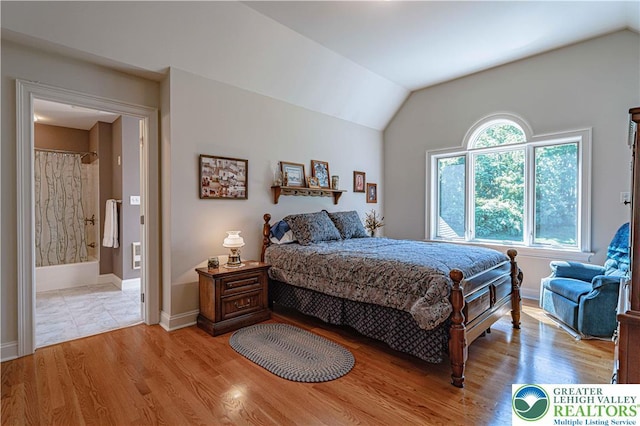 2650 Eagle Ln, Lower Saucon Twp, PA 18055 - bedroom featuring lofted ceiling, light wood-style floors, and connected bathroom