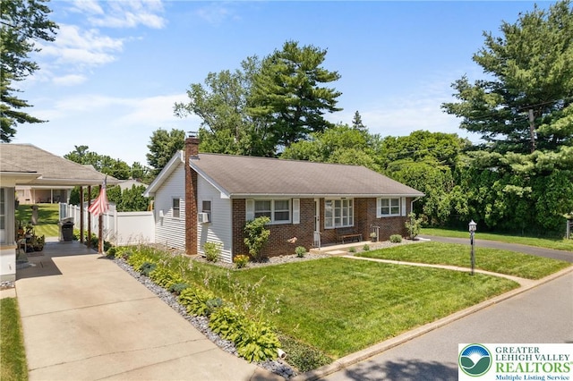 2213 W Woodlawn St, South Whitehall Twp, PA 18104 - view of front of property featuring brick siding, a chimney, driveway, and cooling unit