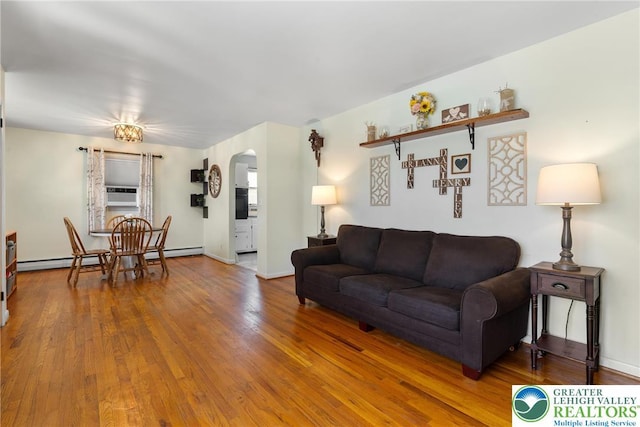 2213 W Woodlawn St, South Whitehall Twp, PA 18104 - living area with arched walkways, wood finished floors, a baseboard radiator, and cooling unit