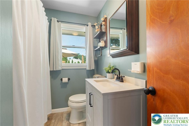 2213 W Woodlawn St, South Whitehall Twp, PA 18104 - bathroom with vanity, wood finished floors, and a shower with shower curtain