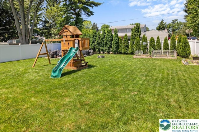 2213 W Woodlawn St, South Whitehall Twp, PA 18104 - view of jungle gym featuring a fenced backyard and a garden