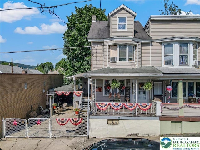 259 5th St, Coaldale Boro, PA 18218 - view of front facade with a porch, a gate, roof with shingles, and cooling unit