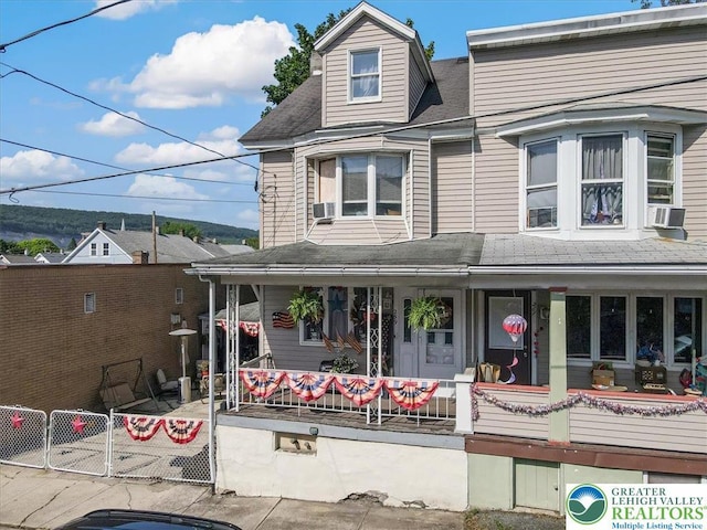 259 5th St, Coaldale Boro, PA 18218 - view of front of house featuring covered porch, a shingled roof, and cooling unit