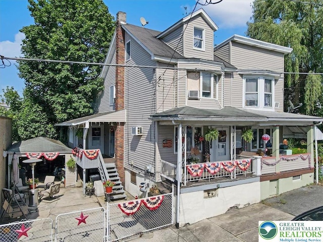259 5th St, Coaldale Boro, PA 18218 - view of front of house featuring a chimney, covered porch, and a gate