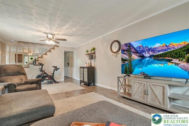 259 5th St, Coaldale Boro, PA 18218 - living room featuring wood finished floors, ceiling fan, ornamental molding, and stairway