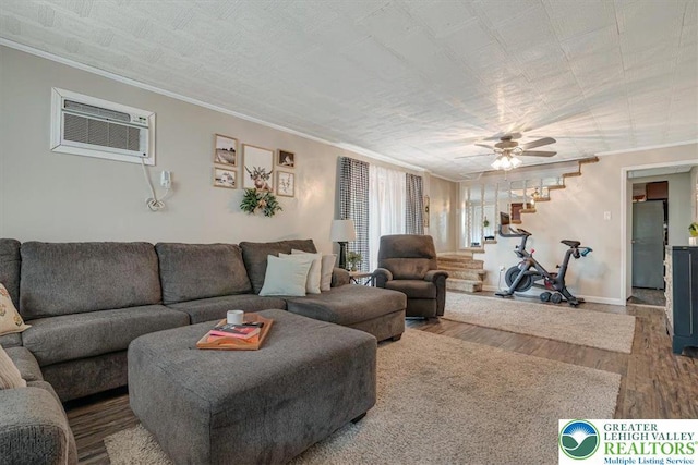 259 5th St, Coaldale Boro, PA 18218 - living area with ornamental molding, a wall mounted AC, wood finished floors, stairs, and a ceiling fan