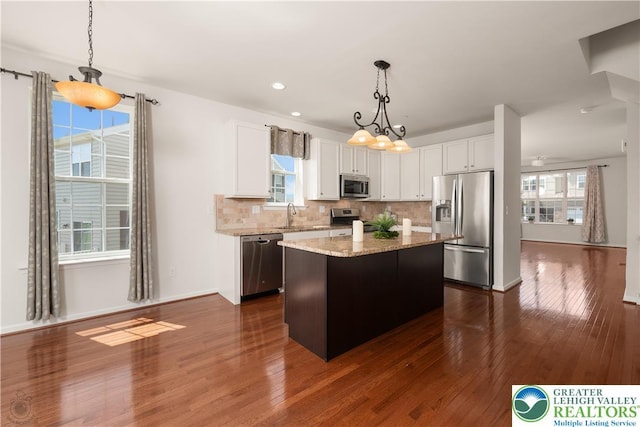 4618 Woodbrush Way, Upper Macungie Twp, PA 18104 - kitchen with appliances with stainless steel finishes, dark wood-style flooring, white cabinets, tasteful backsplash, and recessed lighting