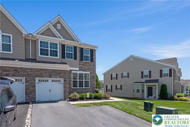 4618 Woodbrush Way, Upper Macungie Twp, PA 18104 - view of front facade featuring a front yard, a garage, stone siding, and driveway