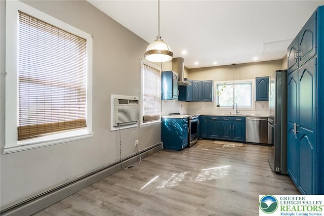 2103 N 1st Ave, Whitehall Twp, PA 18052 - kitchen with stainless steel appliances, a baseboard heating unit, blue cabinets, an AC wall unit, and recessed lighting