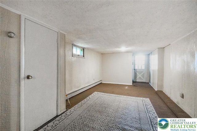 2103 N 1st Ave, Whitehall Twp, PA 18052 - basement with baseboard heating, a textured ceiling, and carpet flooring