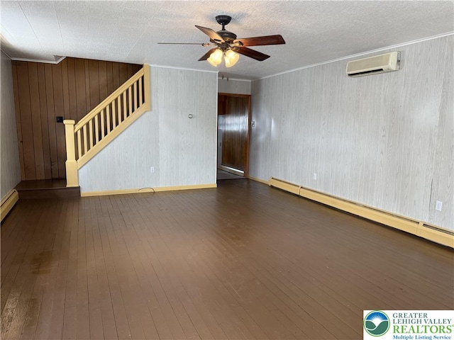 432 3rd St, Lehighton Boro, PA 18235 - unfurnished room featuring an AC wall unit, ceiling fan, stairs, crown molding, and a baseboard heating unit