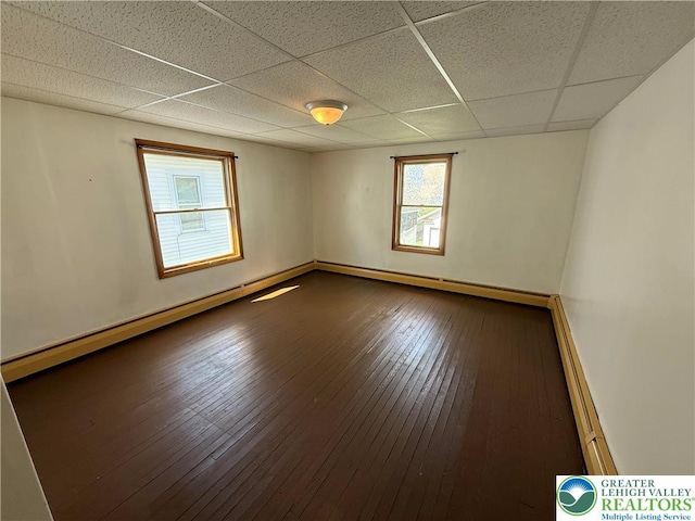 432 3rd St, Lehighton Boro, PA 18235 - unfurnished room featuring a paneled ceiling, a baseboard heating unit, and hardwood / wood-style floors