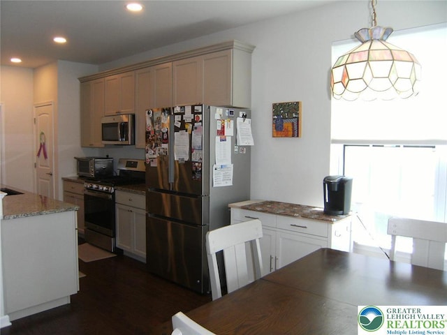 4088 Eveningstar Rd, Emmaus Boro, PA 18049 - kitchen with appliances with stainless steel finishes, recessed lighting, dark wood-style floors, pendant lighting, and light stone countertops