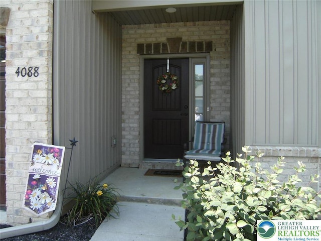 4088 Eveningstar Rd, Emmaus Boro, PA 18049 - property entrance featuring board and batten siding and brick siding