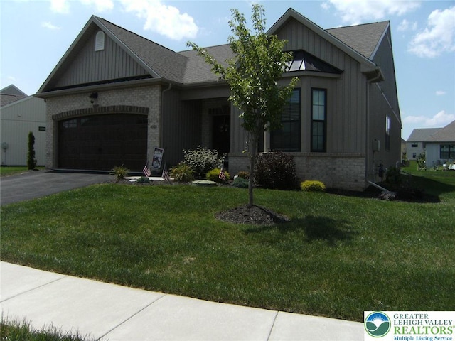 4088 Eveningstar Rd, Emmaus Boro, PA 18049 - view of front facade featuring brick siding, an attached garage, board and batten siding, and a front yard