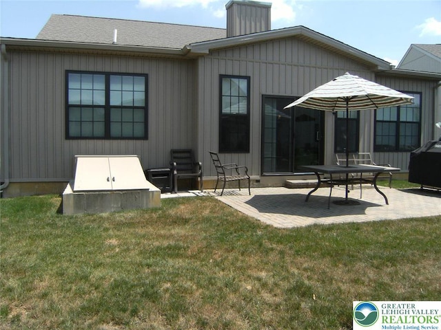 4088 Eveningstar Rd, Emmaus Boro, PA 18049 - back of house with a patio, a yard, and a chimney