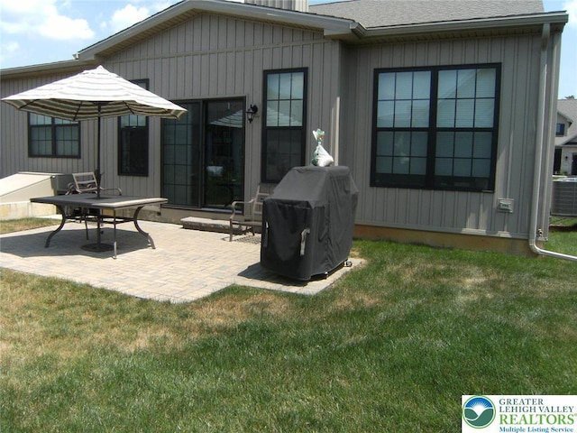 4088 Eveningstar Rd, Emmaus Boro, PA 18049 - back of property with a patio, a yard, and roof with shingles