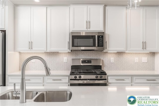 1022 Watson Ct, Upper Macungie Twp, PA 18051 - kitchen featuring appliances with stainless steel finishes, light countertops, and white cabinets