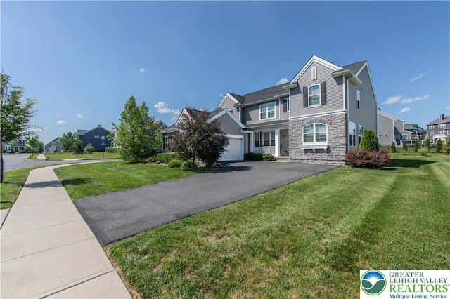 2835 Lenape, Forks Twp, PA 18040 - view of front of home featuring stone siding, a front lawn, asphalt driveway, and a residential view