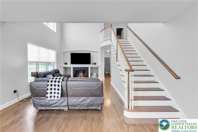 2835 Lenape, Forks Twp, PA 18040 - living area featuring plenty of natural light, stairs, wood finished floors, and a high ceiling