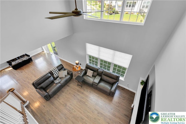 2835 Lenape, Forks Twp, PA 18040 - living room with a towering ceiling, a ceiling fan, healthy amount of natural light, and wood finished floors