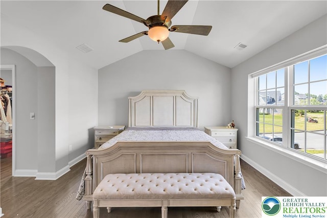 2835 Lenape, Forks Twp, PA 18040 - bedroom with wood finished floors, a walk in closet, lofted ceiling, a ceiling fan, and arched walkways