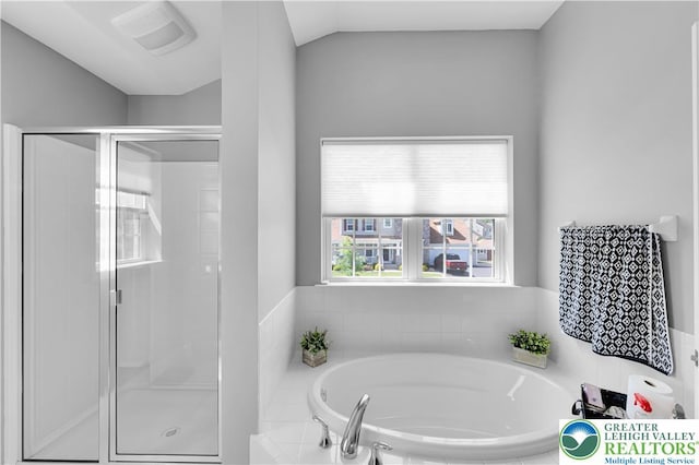 2835 Lenape, Forks Twp, PA 18040 - bathroom featuring a garden tub, a shower stall, and lofted ceiling