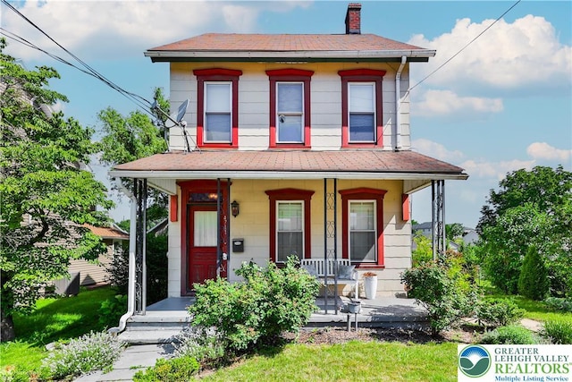 4711 Main St, Whitehall Twp, PA 18052 - view of front of house featuring covered porch and a chimney