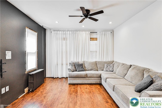4711 Main St, Whitehall Twp, PA 18052 - living room featuring radiator heating unit, a ceiling fan, wood finished floors, and recessed lighting