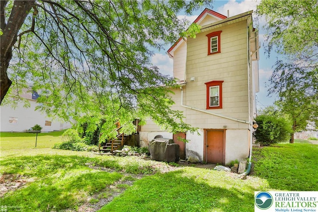 4711 Main St, Whitehall Twp, PA 18052 - back of house featuring stairway