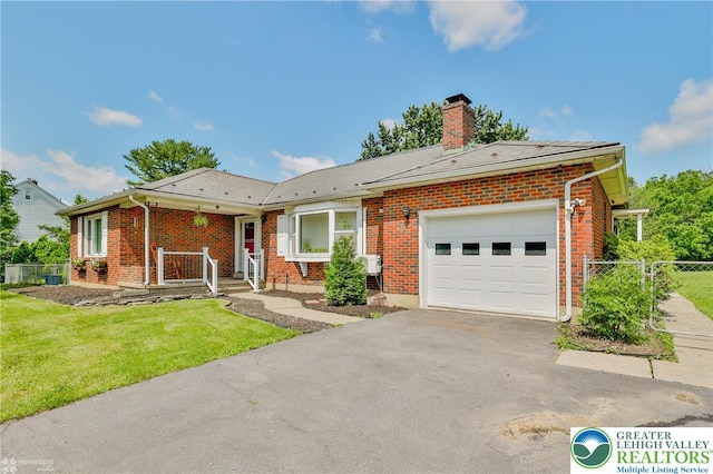 236 Moorestown Rd, Bushkill Twp, PA 18091 - view of front of house with an attached garage, driveway, a chimney, and brick siding