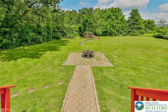 236 Moorestown Rd, Bushkill Twp, PA 18091 - view of grassy yard featuring a fire pit and a playground