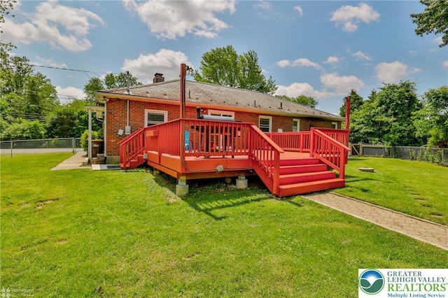 236 Moorestown Rd, Bushkill Twp, PA 18091 - rear view of house featuring a fenced backyard, a chimney, a wooden deck, and brick siding