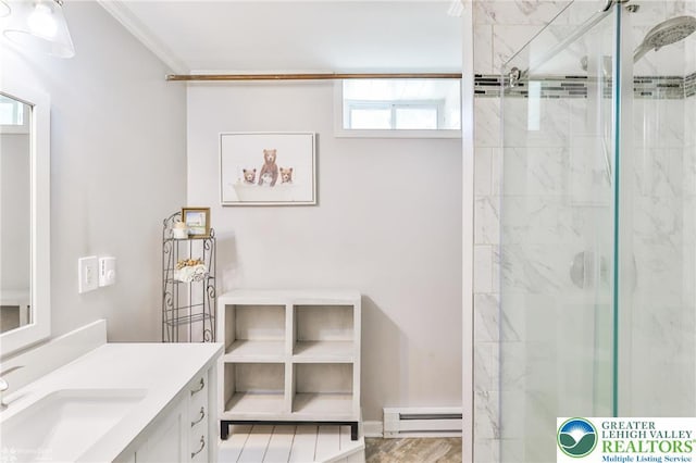236 Moorestown Rd, Bushkill Twp, PA 18091 - bathroom featuring baseboard heating, a stall shower, vanity, and ornamental molding