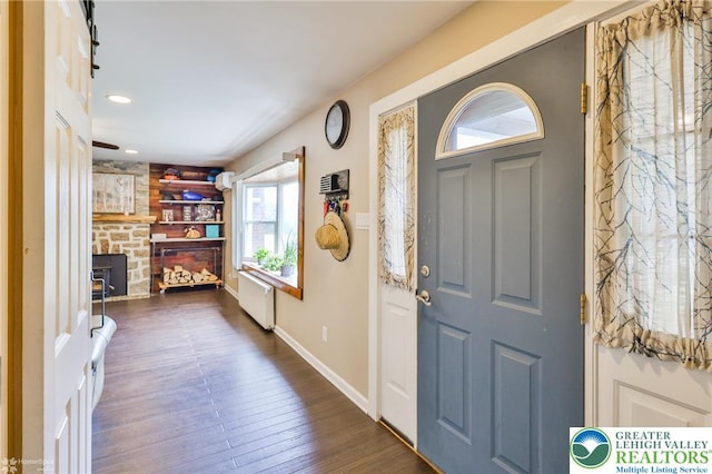 236 Moorestown Rd, Bushkill Twp, PA 18091 - entryway with dark wood-style floors, a fireplace, and recessed lighting