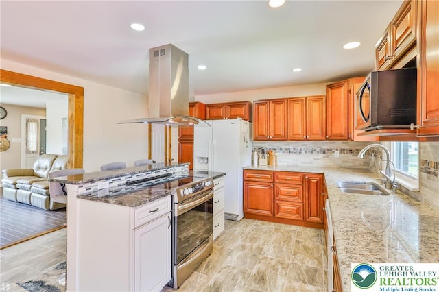 236 Moorestown Rd, Bushkill Twp, PA 18091 - kitchen with island exhaust hood, stainless steel appliances, light stone counters, decorative backsplash, and recessed lighting