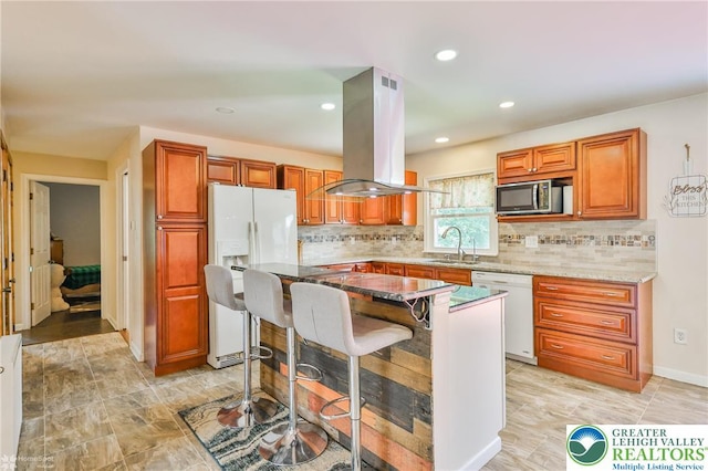 236 Moorestown Rd, Bushkill Twp, PA 18091 - kitchen with white appliances, island range hood, tasteful backsplash, light stone countertops, and recessed lighting
