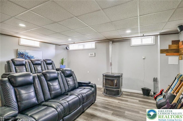 236 Moorestown Rd, Bushkill Twp, PA 18091 - home theater featuring a wood stove, wood finished floors, recessed lighting, healthy amount of natural light, and a paneled ceiling
