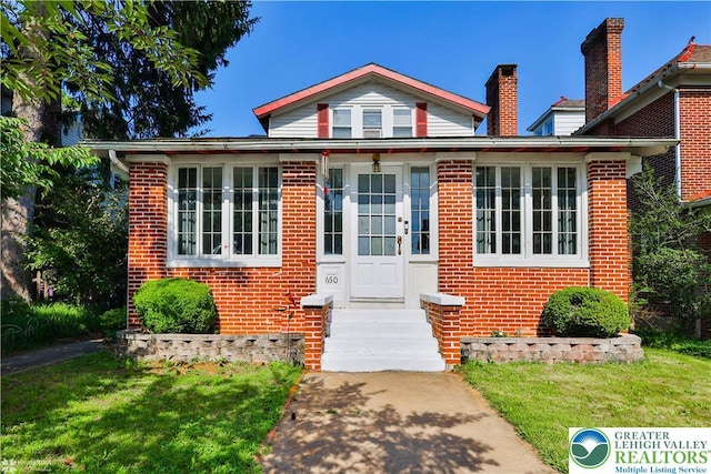 650 Highland Ave, Bethlehem City, PA 18018 - bungalow-style house featuring brick siding, a front lawn, and entry steps