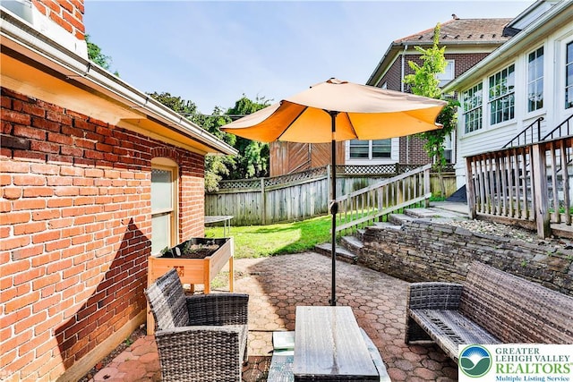 650 Highland Ave, Bethlehem City, PA 18018 - fenced backyard featuring a patio and stairs