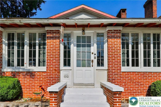 650 Highland Ave, Bethlehem City, PA 18018 - property entrance featuring brick siding and a chimney