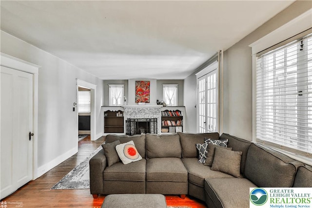650 Highland Ave, Bethlehem City, PA 18018 - living area with wood finished floors and a brick fireplace