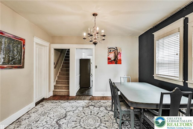 650 Highland Ave, Bethlehem City, PA 18018 - dining area featuring a chandelier, stairs, and wood finished floors