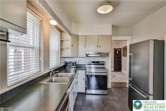 650 Highland Ave, Bethlehem City, PA 18018 - kitchen featuring stainless steel appliances, under cabinet range hood, dark countertops, open shelves, and cream cabinets