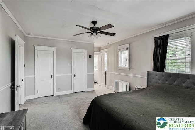 650 Highland Ave, Bethlehem City, PA 18018 - bedroom featuring radiator heating unit, ornamental molding, carpet, ceiling fan, and multiple closets