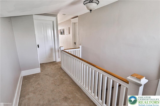 650 Highland Ave, Bethlehem City, PA 18018 - corridor featuring carpet floors and an upstairs landing