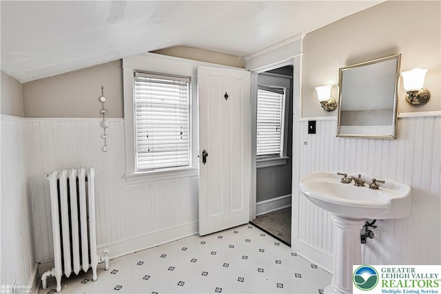 650 Highland Ave, Bethlehem City, PA 18018 - bathroom with radiator heating unit, lofted ceiling, tile patterned floors, and wainscoting