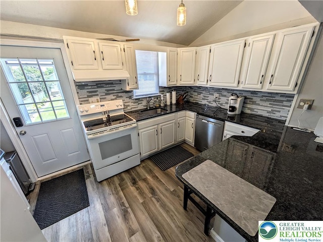 135 N 2nd St, Coplay Boro, PA 18037 - kitchen with stainless steel dishwasher, white electric range oven, vaulted ceiling, tasteful backsplash, and white cabinets