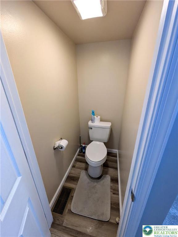 135 N 2nd St, Coplay Boro, PA 18037 - bathroom featuring wood finished floors